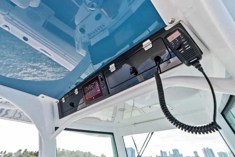 Slide: The Image of 2023 HCB 42 Lujo boat cockpit with navigation equipment and radio system. - 29