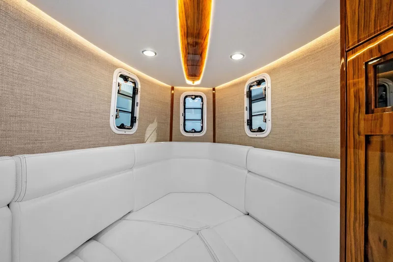 Slide: The Image of Luxurious interior of 2023 HCB 42 Lujo boat with elegant seating and ambient lighting. - 37