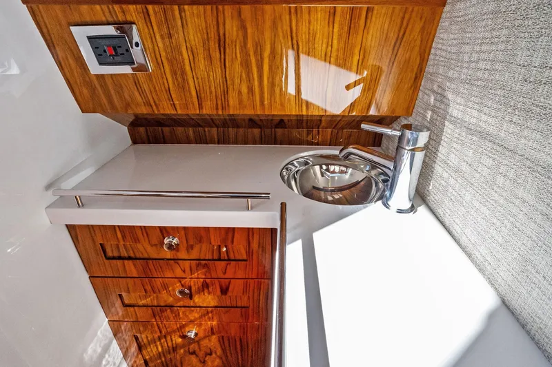 Slide: The Image of Luxurious wooden cabinetry and modern sink in 2023 HCB 42 Lujo yacht interior. - 38