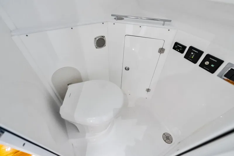 Slide: The Image of 2023 HCB 42 Lujo boat bathroom interior with modern fixtures and controls. - 39