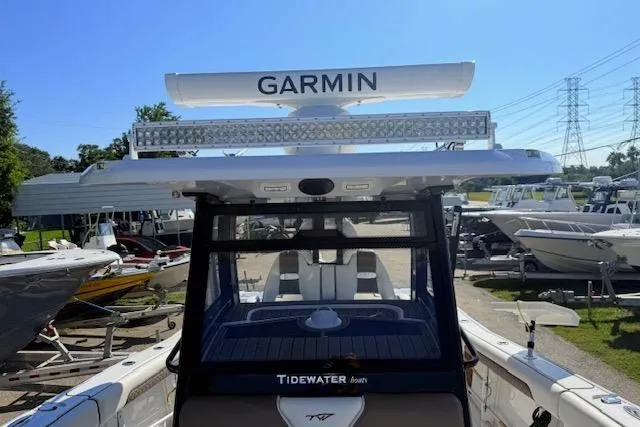 Slide: The Image of 2026 Tidewater 302 CC Adventure boat with Garmin radar, docked in a marina. - 15