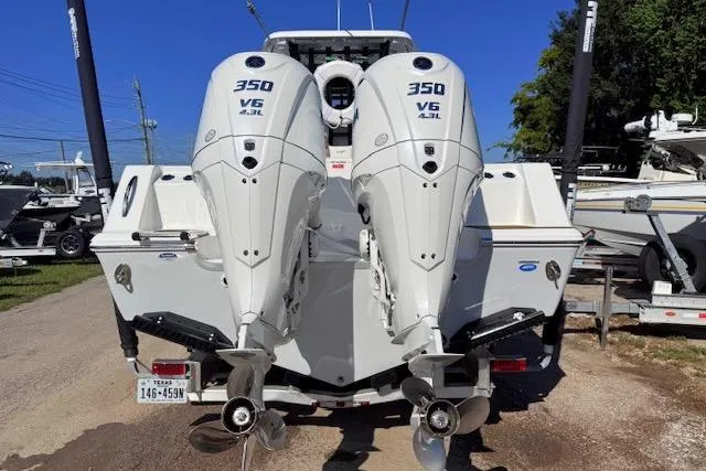Slide: The Image of 2026 Tidewater 302 CC Adventure boat with dual 350 V6 engines, rear view. - 3