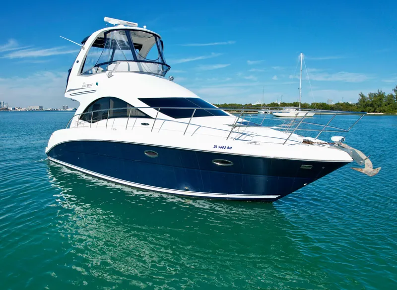 The Image of 2007 Sea Ray 360 Sedan Bridge yacht on clear blue water. - 0