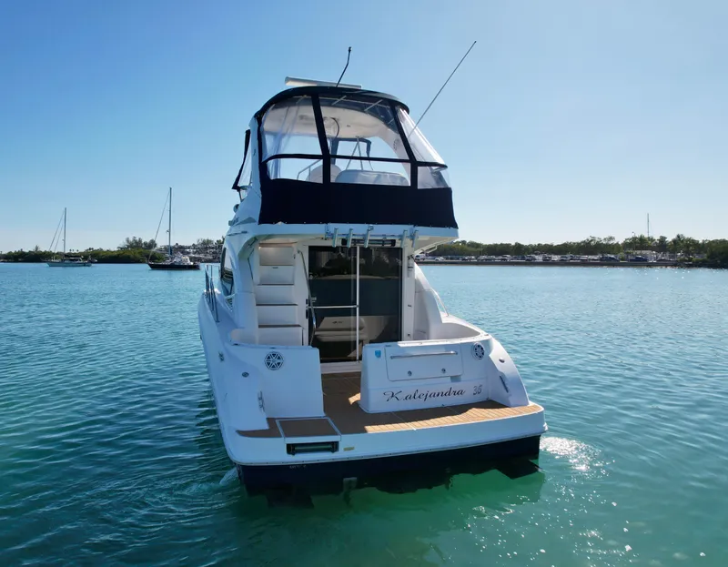 Slide: The Image of 2007 Sea Ray 360 Sedan Bridge yacht on calm water, rear view. - 15