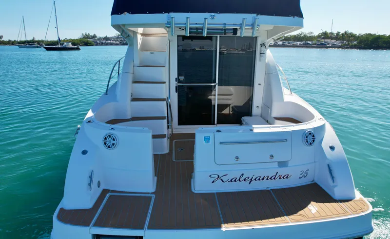 Slide: The Image of 2007 Sea Ray 360 Sedan Bridge yacht on calm blue water. - 17