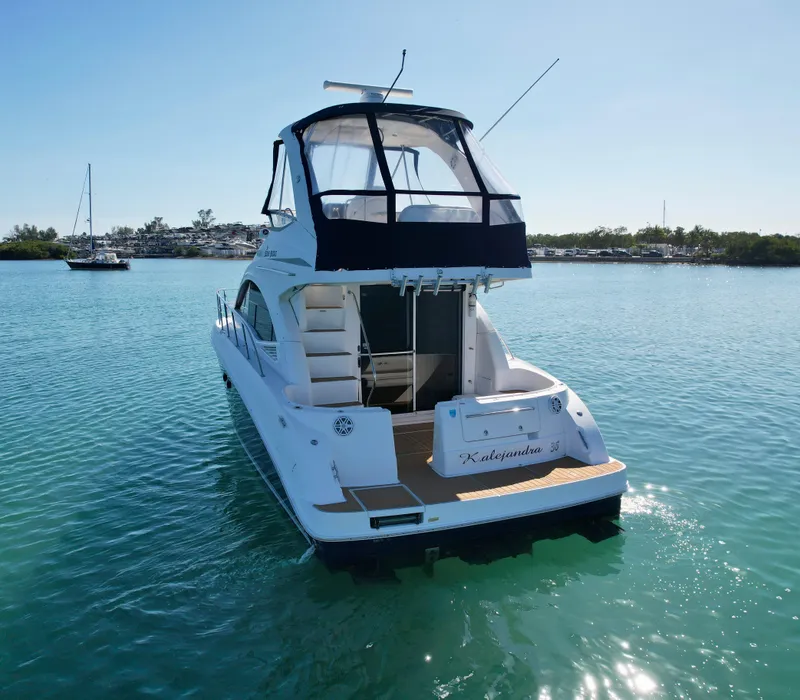 Slide: The Image of 2007 Sea Ray 360 Sedan Bridge yacht on calm water, rear view. - 19