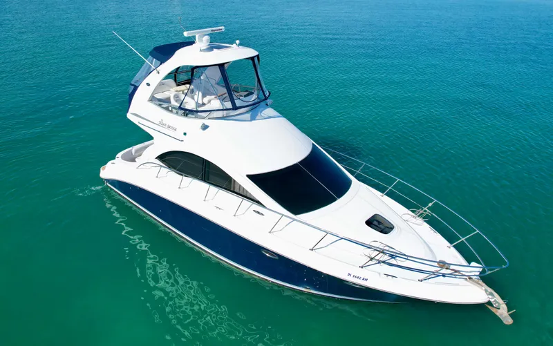 Slide: The Image of 2007 Sea Ray 360 Sedan Bridge yacht on clear blue water. - 2
