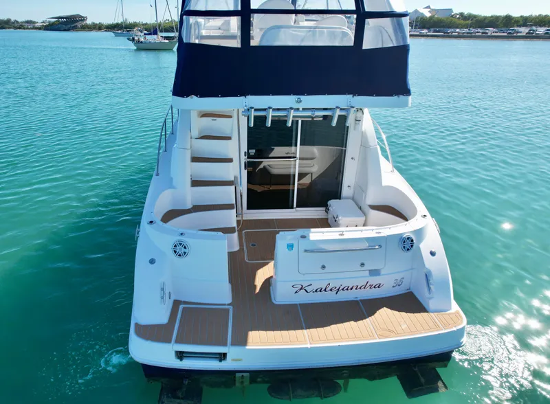 Slide: The Image of 2007 Sea Ray 360 Sedan Bridge yacht on clear blue water, rear view. - 20