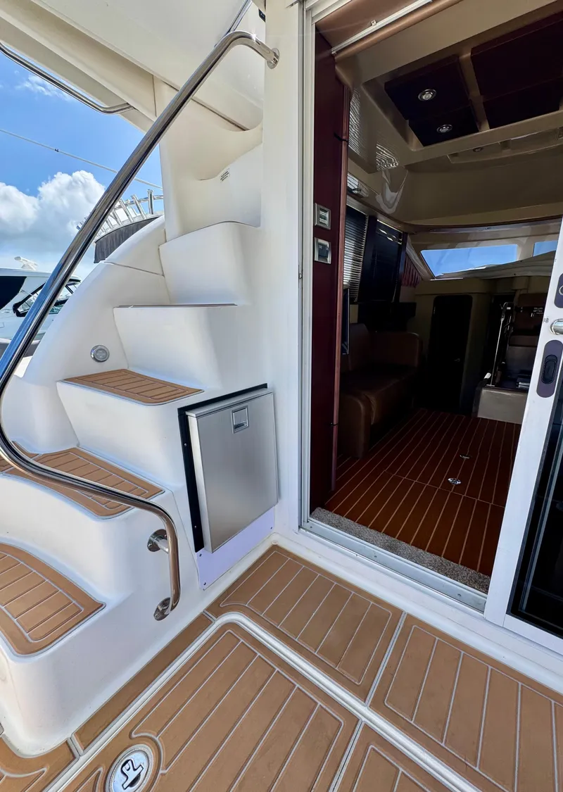 Slide: The Image of 2007 Sea Ray 360 Sedan Bridge yacht interior with stairs and wooden flooring. - 24