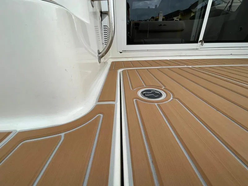 Slide: The Image of 2007 Sea Ray 360 Sedan Bridge deck with teak flooring and sleek design. - 28