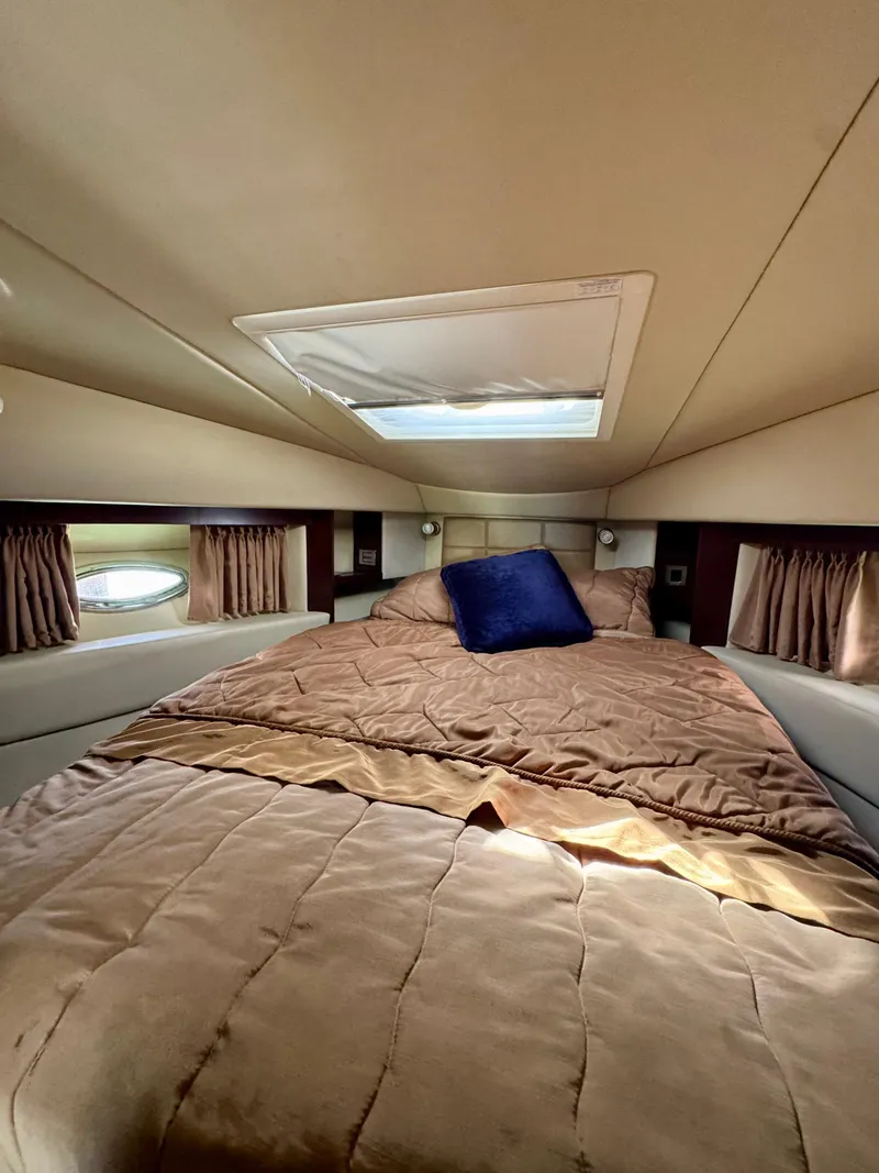 Slide: The Image of Interior cabin of 2007 Sea Ray 360 Sedan Bridge with cozy bed and skylight. - 34