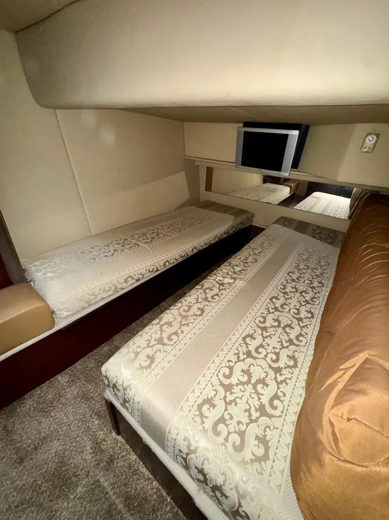 Slide: The Image of 2007 Sea Ray 360 Sedan Bridge cabin with twin beds and TV. - 37