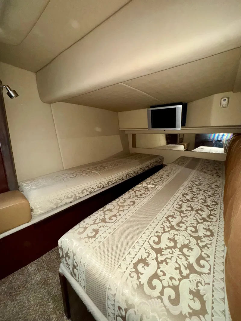 Slide: The Image of 2007 Sea Ray 360 Sedan Bridge cabin with twin beds and elegant bedding. - 38
