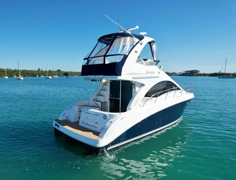 Slide: The Image of 2007 Sea Ray 360 Sedan Bridge yacht on clear blue water. - 5