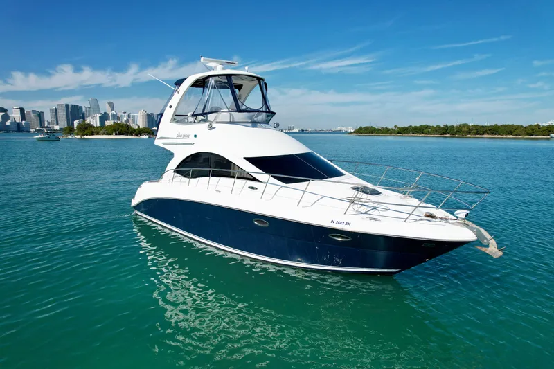 Slide: The Image of 2007 Sea Ray 360 Sedan Bridge yacht cruising on clear blue water. - 6