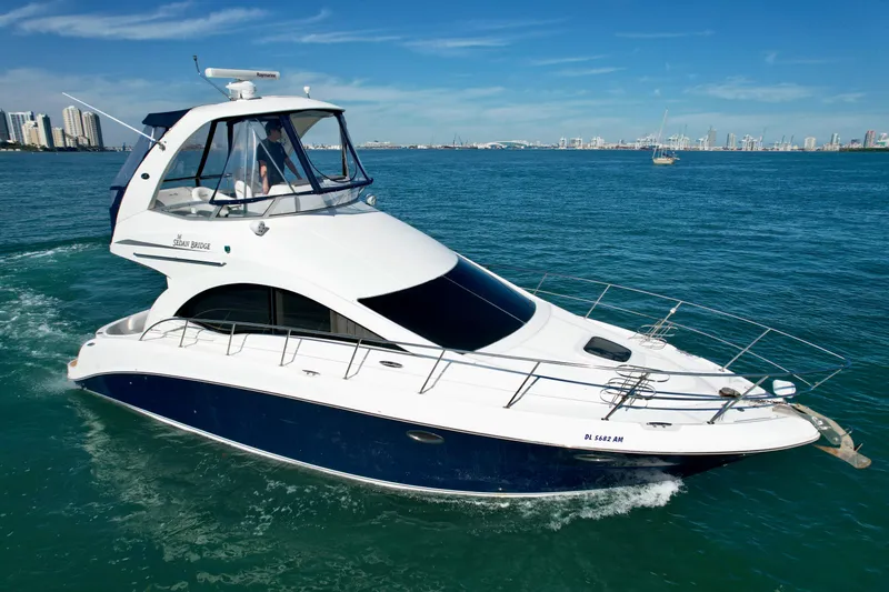 Slide: The Image of 2007 Sea Ray 360 Sedan Bridge yacht cruising on open water. - 7
