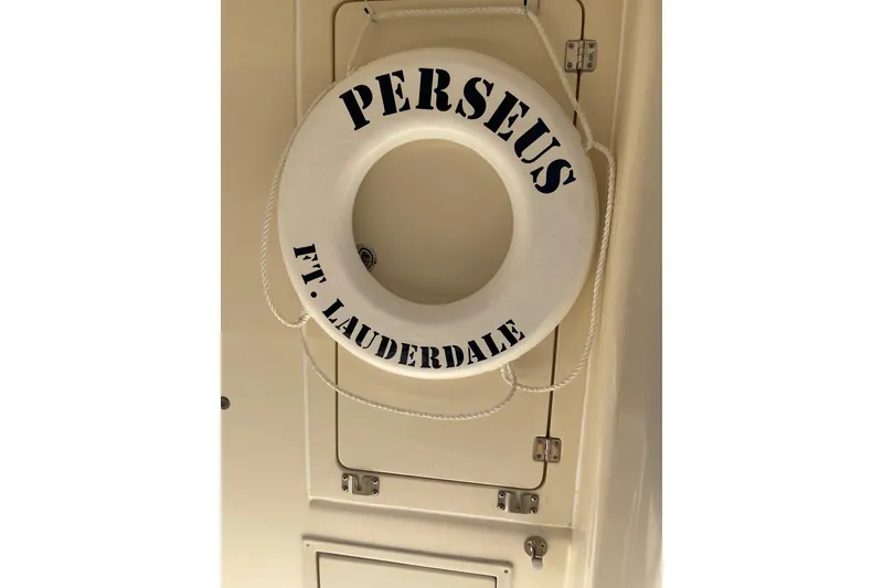 Slide: The Image of Interior of 2008 Mainship 34 Trawler Hardtop with blue sofa and nautical decor. - 13