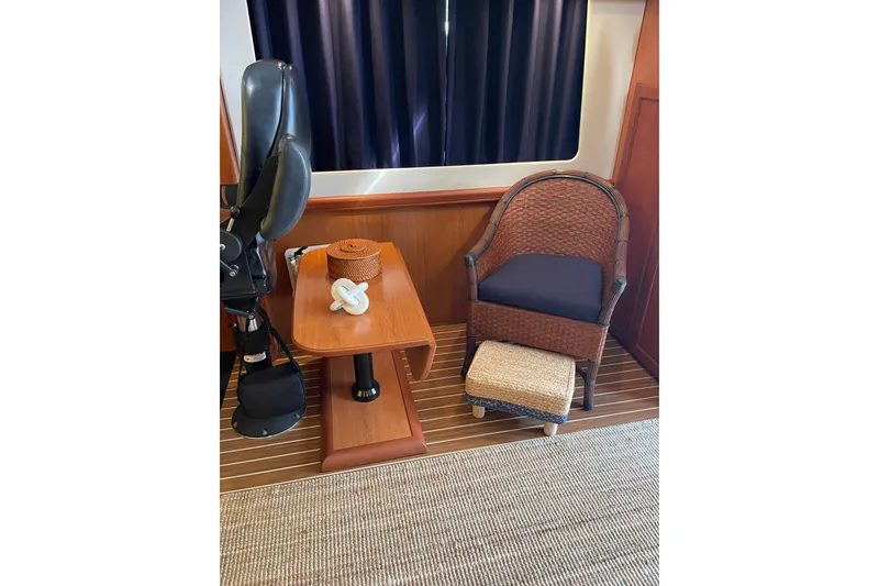 Slide: The Image of Interior of 2008 Mainship 34 Trawler Hardtop with TV and wooden cabinetry. - 15