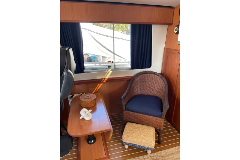 Slide: The Image of 2008 Mainship 34 Trawler Hardtop interior with helm, steering wheel, and captain's chair. - 21