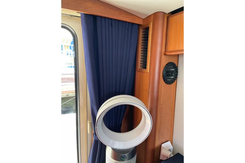 Slide: The Image of Bathroom interior of 2008 Mainship 34 Trawler Hardtop with sink and porthole window. - 29
