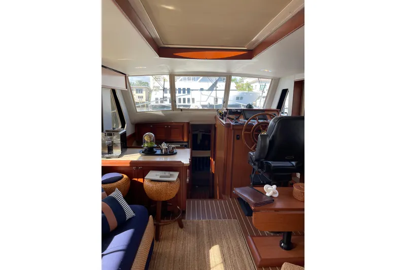 Slide: The Image of 2008 Mainship 34 Trawler Hardtop dashboard with Garmin display and gauges. - 32