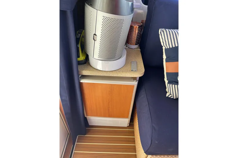 Slide: The Image of 2008 Mainship 34 Trawler Hardtop dashboard with Garmin GPS and analog gauges. - 34