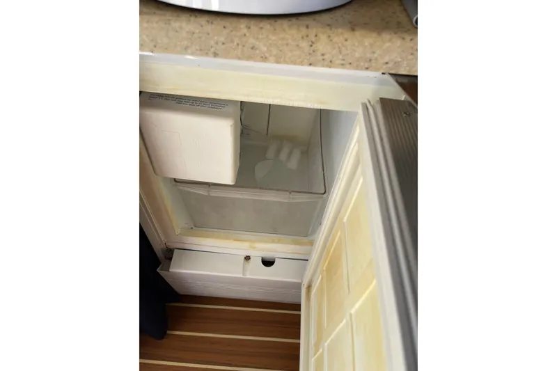 Slide: The Image of Electrical control panel on 2008 Mainship 34 Trawler Hardtop, featuring AC and DC distribution. - 35