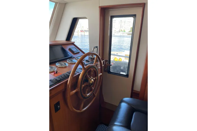 Slide: The Image of Open hatch on 2008 Mainship 34 Trawler Hardtop, revealing interior storage compartment. - 37