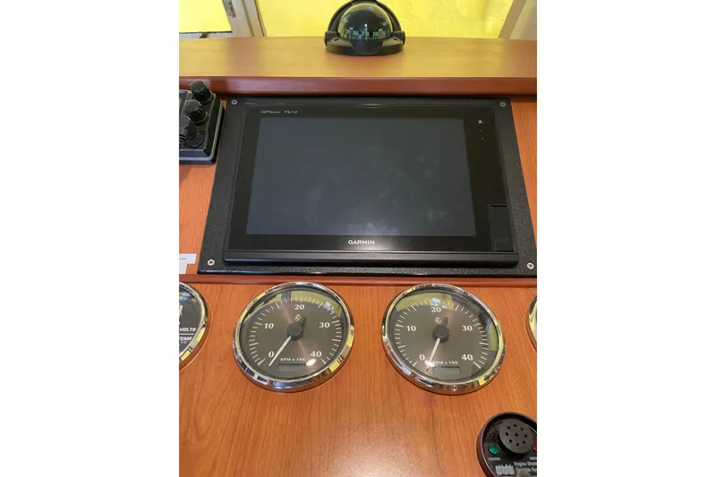 Slide: The Image of Engine room of 2008 Mainship 34 Trawler Hardtop, showcasing mechanical components and wiring. - 41