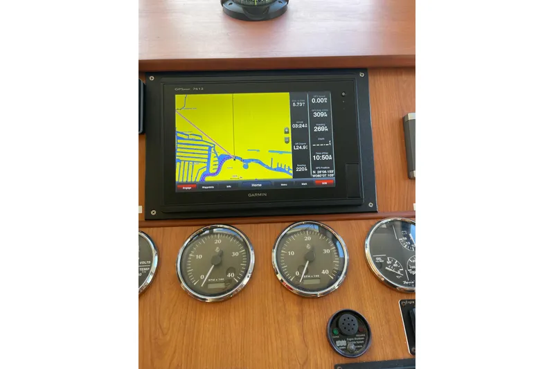 Slide: The Image of Engine room of 2008 Mainship 34 Trawler Hardtop, showcasing detailed mechanical components. - 43