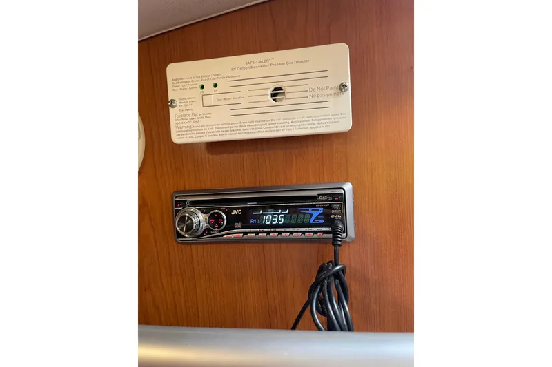 Slide: The Image of Engine room of 2008 Mainship 34 Trawler Hardtop, featuring well-maintained machinery and lighting. - 46