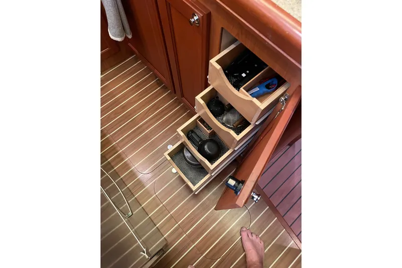 Slide: The Image of Engine compartment of 2008 Mainship 34 Trawler Hardtop with Kohler control panel and oil exchange system. - 49