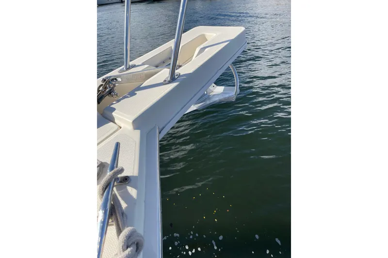 Slide: The Image of 2008 Mainship 34 Trawler Hardtop docked near tropical waterfront property. - 9