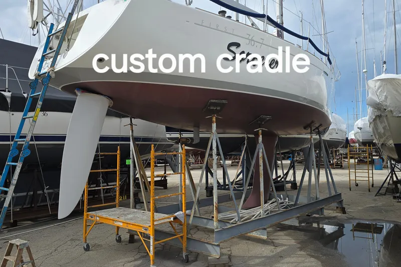 Slide: The Image of 2003 Beneteau First 36.7 sailboat on custom cradle in boatyard. - 28