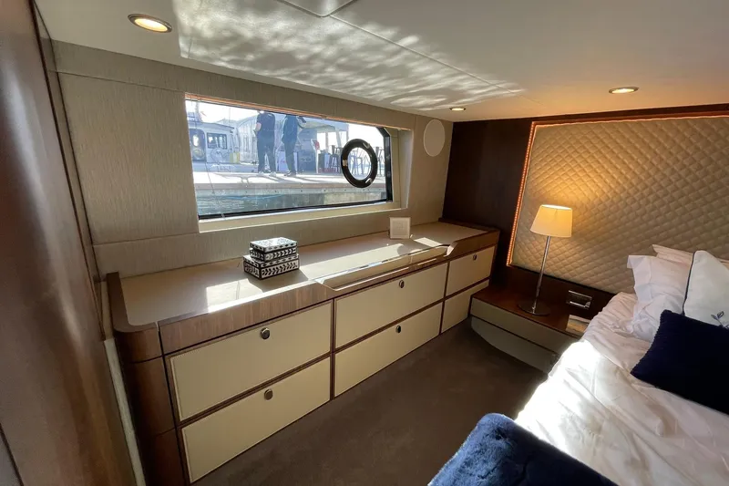 Slide: The Image of Luxurious cabin interior of 2025 Fairline Squadron 50 yacht, featuring elegant furnishings and ambient lighting. - 30