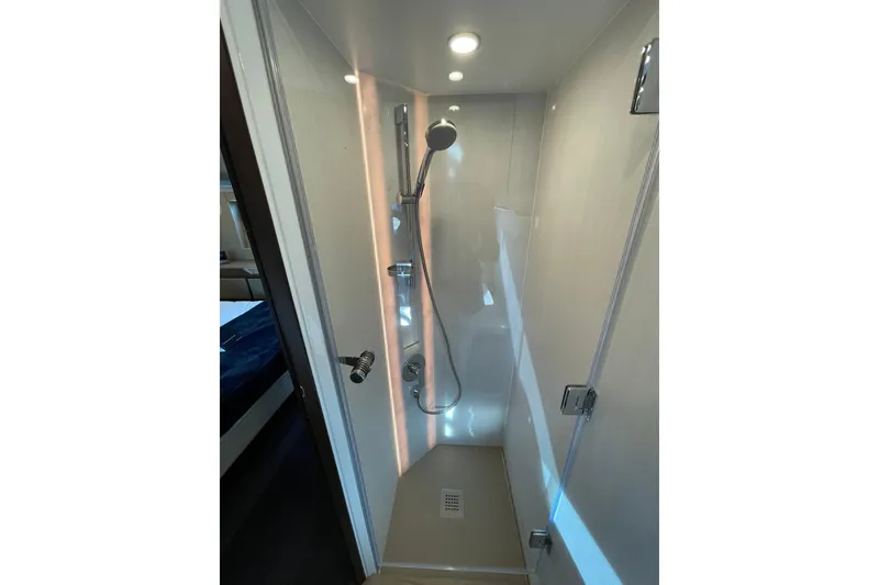 Slide: The Image of Modern shower in 2025 Fairline Squadron 50 yacht, featuring sleek design and ambient lighting. - 35