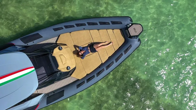 Slide: The Image of Aerial view of a person relaxing on a 2025 Ranieri CAYMAN 38.0 EXECUTIVE yacht. - 2