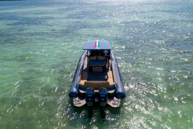 Slide: The Image of 2025 Ranieri CAYMAN 38.0 EXECUTIVE boat on clear turquoise water. - 3