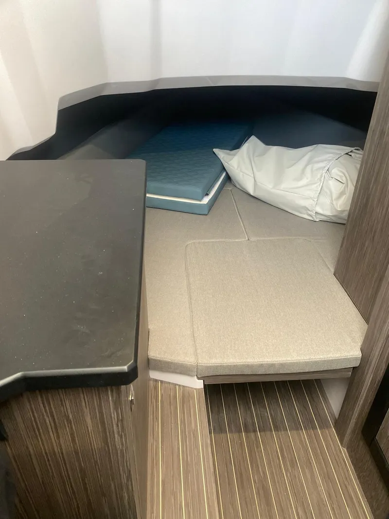 Slide: The Image of Interior cabin of 2025 Ranieri CAYMAN 38.0 EXECUTIVE with cushioned seating and wooden flooring. - 47