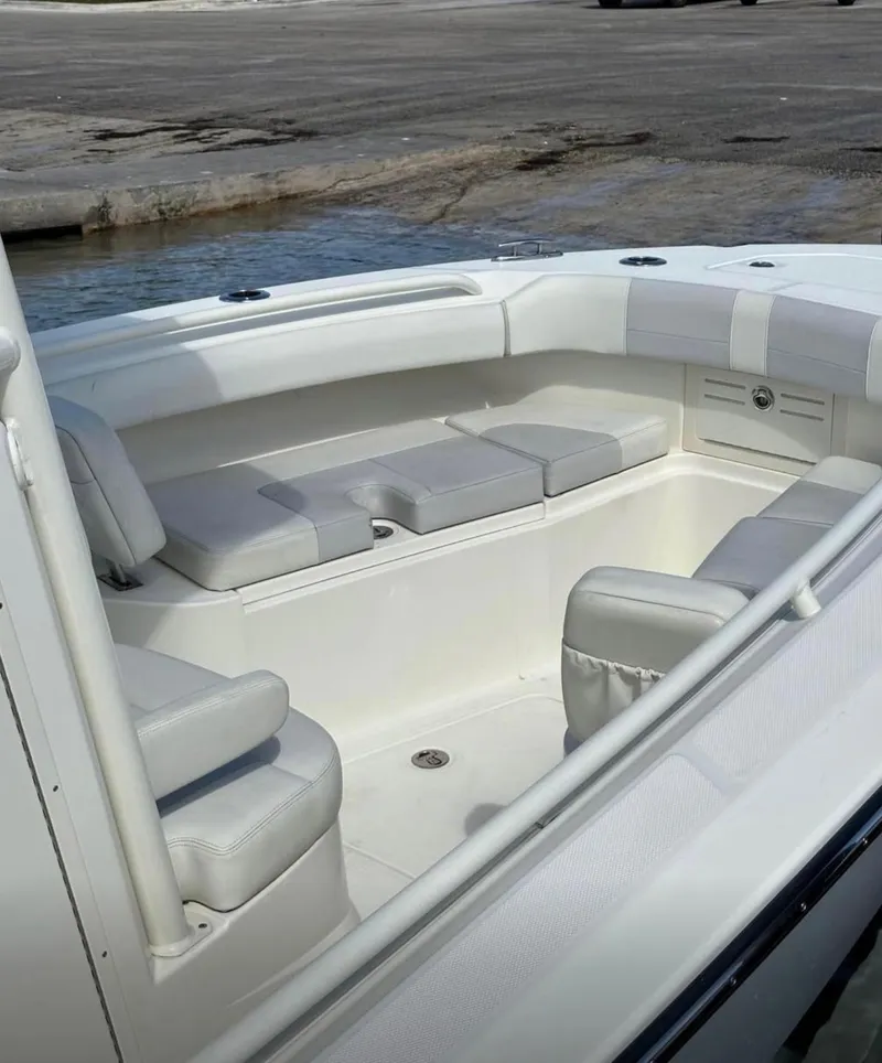 Slide: The Image of 2020 Mako 236 CC boat interior with cushioned seating and sleek design. - 13