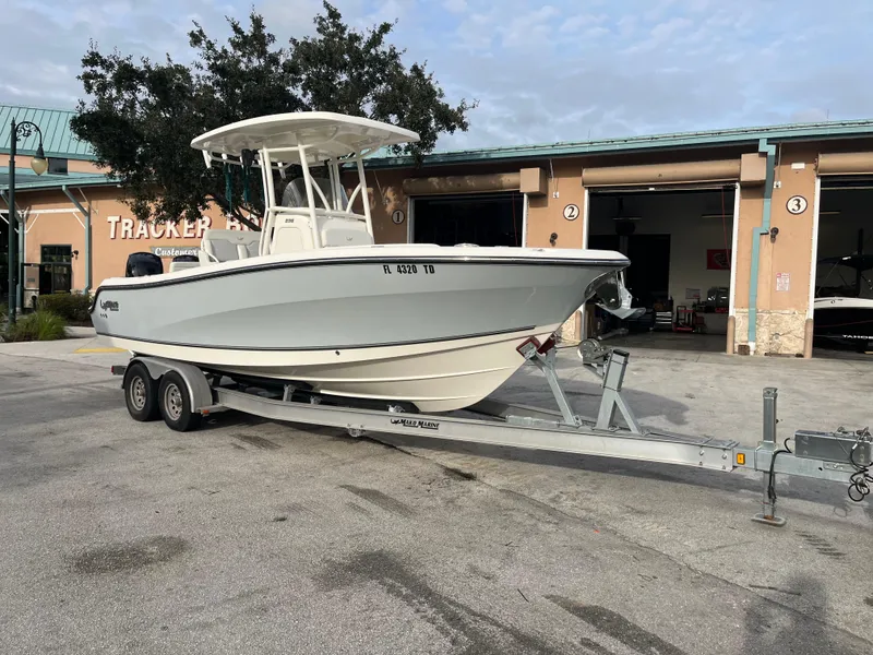 Slide: The Image of 2020 Mako 236 CC boat on trailer outside Tracker dealership. - 23