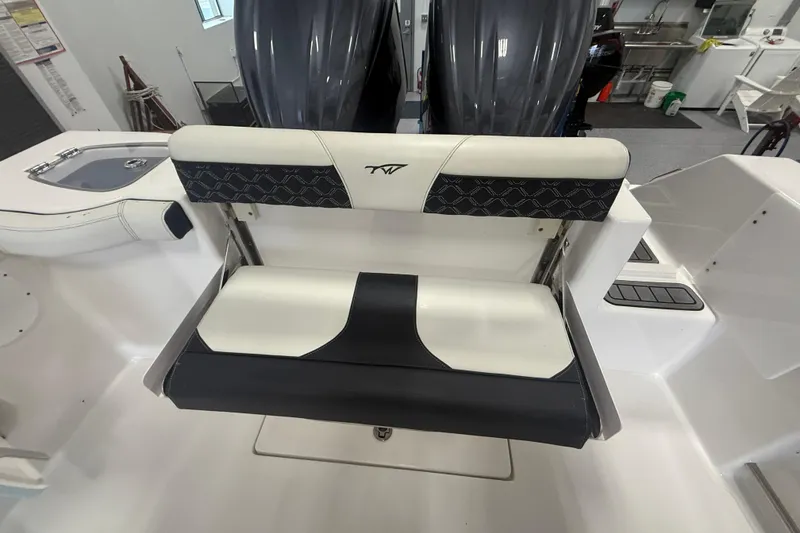 Slide: The Image of 2022 Tidewater 272 CC Adventure boat seat with stylish black and white design. - 10