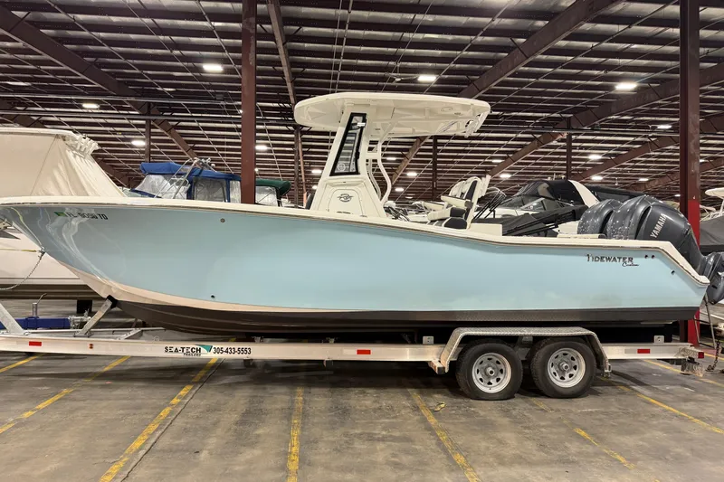 Slide: The Image of 2022 Tidewater 272 CC Adventure boat on trailer in indoor storage facility. - 25