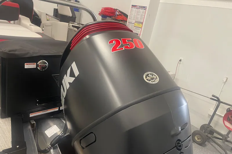 Slide: The Image of 2024 Tahoe Pontoon Cascade with Suzuki 250 outboard motor in showroom. - 18