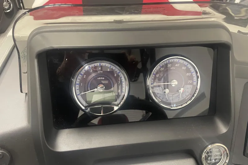 Slide: The Image of Dashboard of 2024 Tahoe Pontoon Cascade Versatile Rear Bench with RPM and speed gauges. - 20