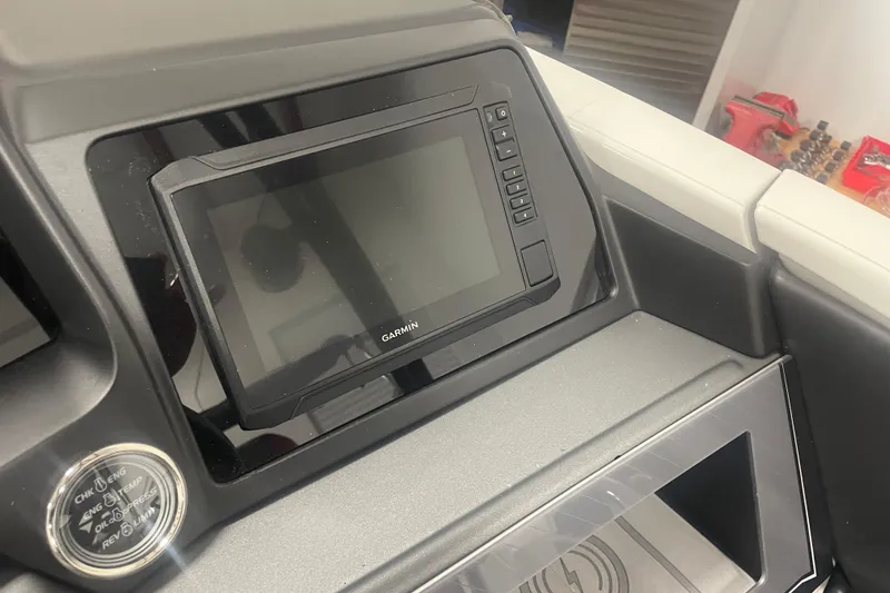 Slide: The Image of 2024 Tahoe Pontoon Cascade dashboard with Garmin display and control panel. - 21