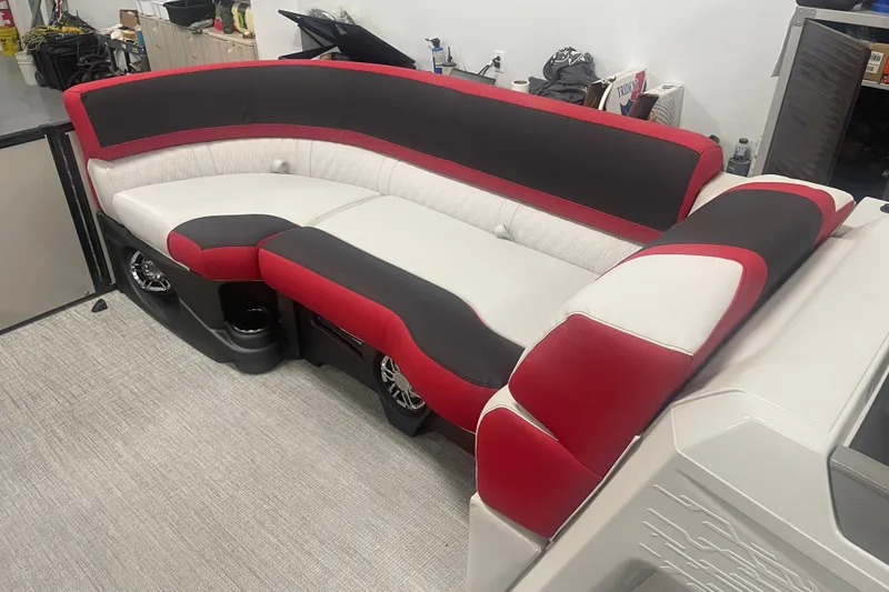 Slide: The Image of 2024 Tahoe Pontoon Cascade Versatile Rear Bench with red, black, and white upholstery. - 31