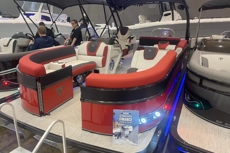 Slide: The Image of 2024 Tahoe Pontoon Cascade Versatile Rear Bench with red and white seating on display. - 35