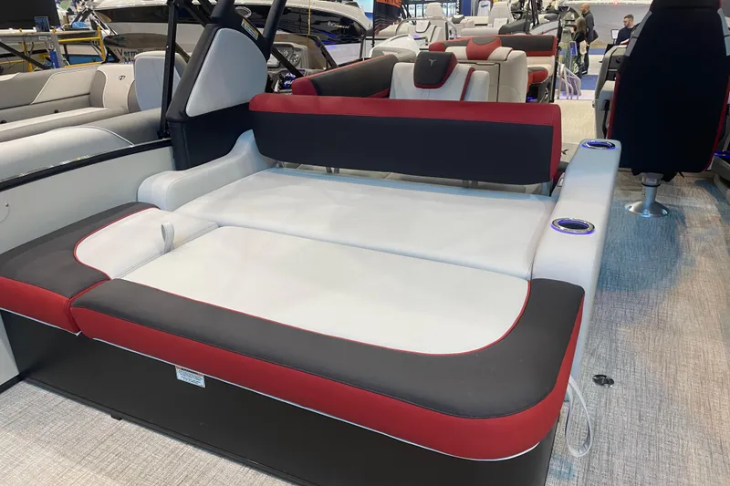 Slide: The Image of 2024 Tahoe Pontoon Cascade Versatile Rear Bench with red and black upholstery, featuring cup holders. - 6