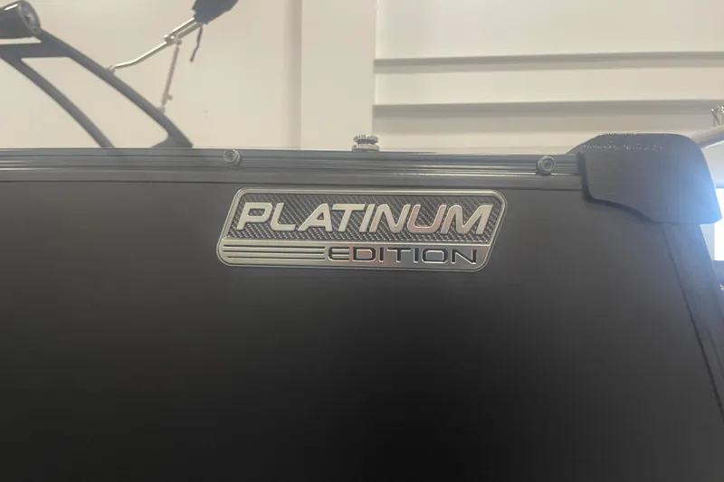 Slide: The Image of 2024 Tahoe Pontoon Cascade Versatile Rear Bench, Platinum Edition badge detail. - 8